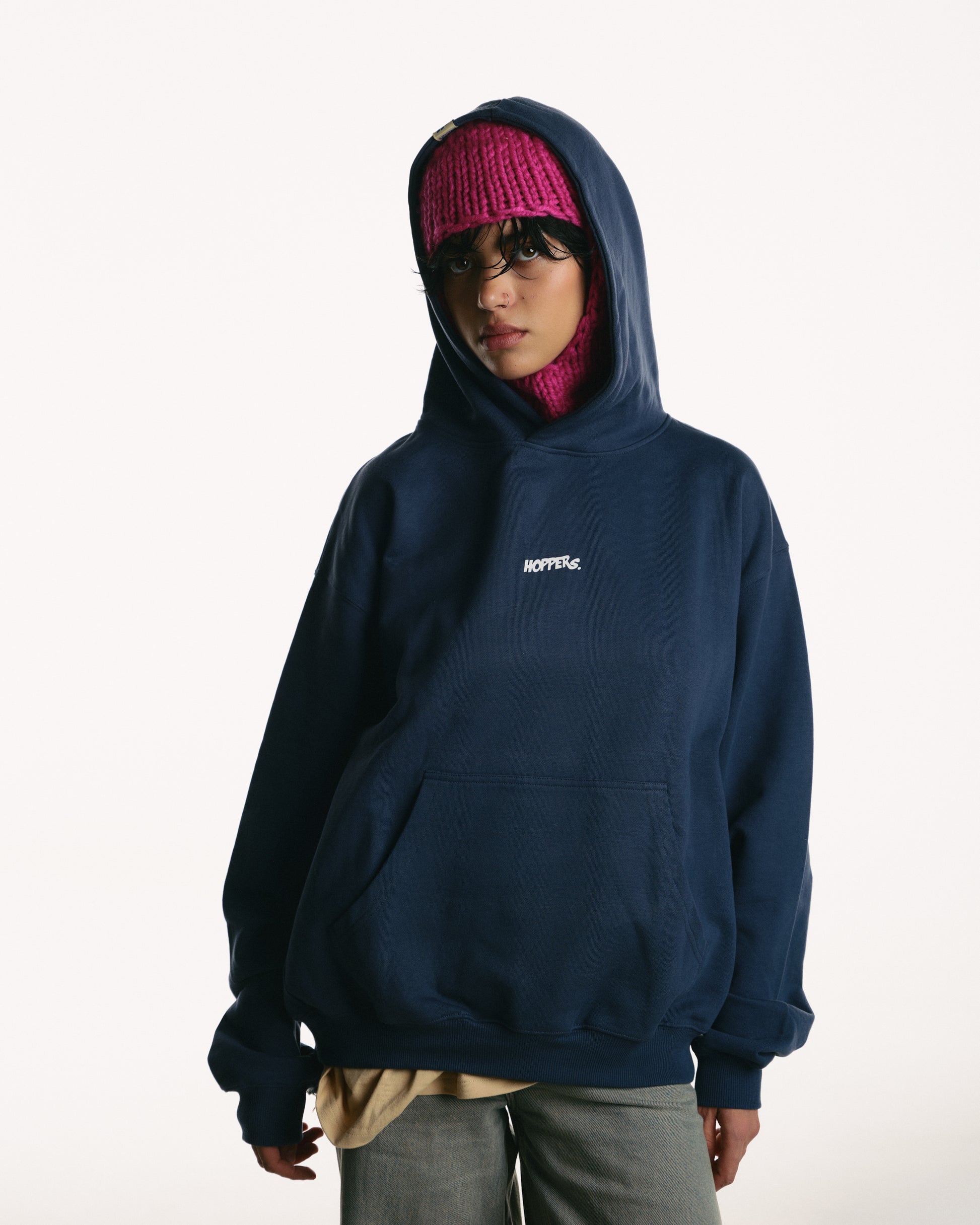 Person wearing a navy hoodie with a brand logo on a white background, Hanorac oversize unisex „Talking to Myself” culoare navy, vedere frontală cu glugă
